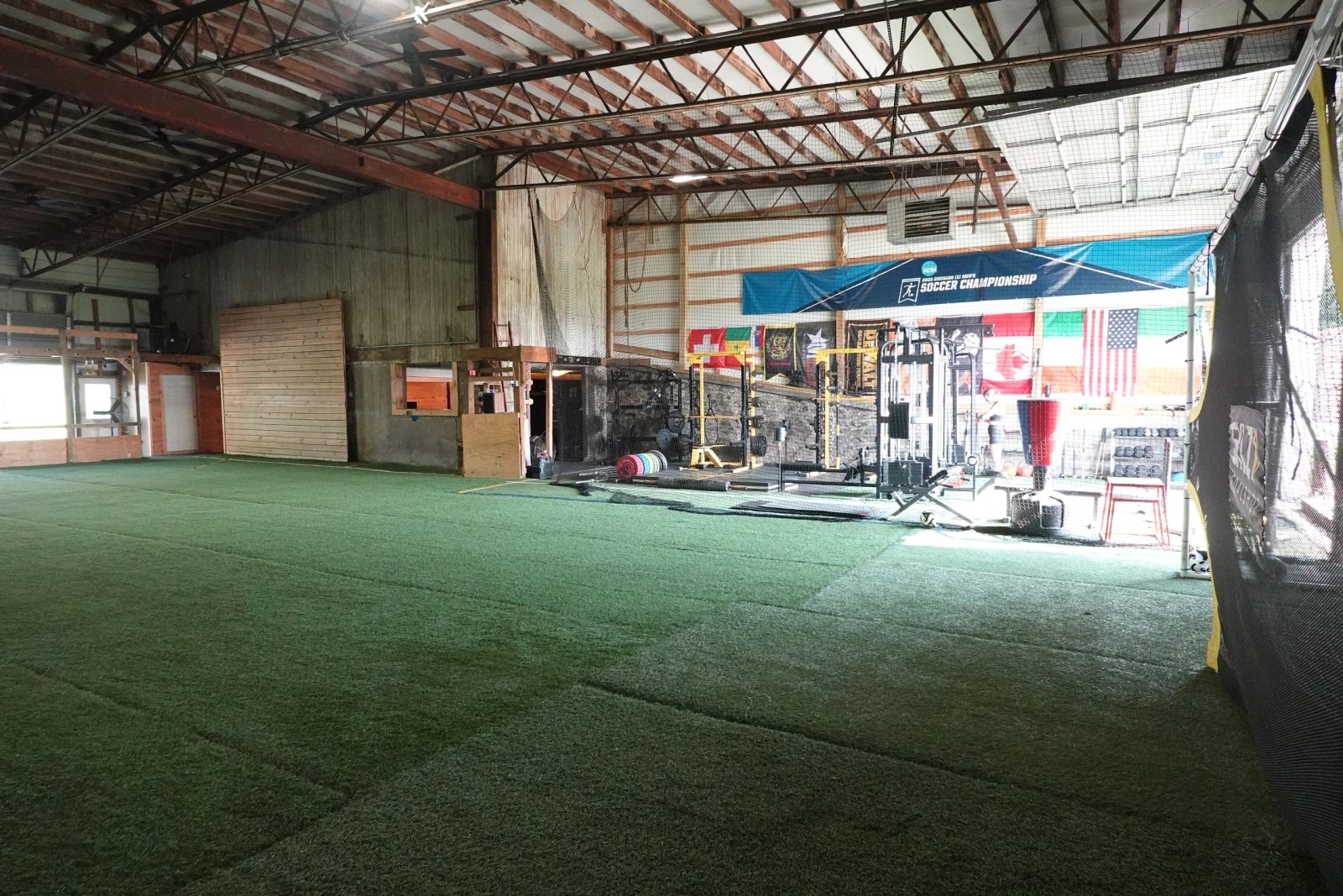 Indoor turf field with international flags